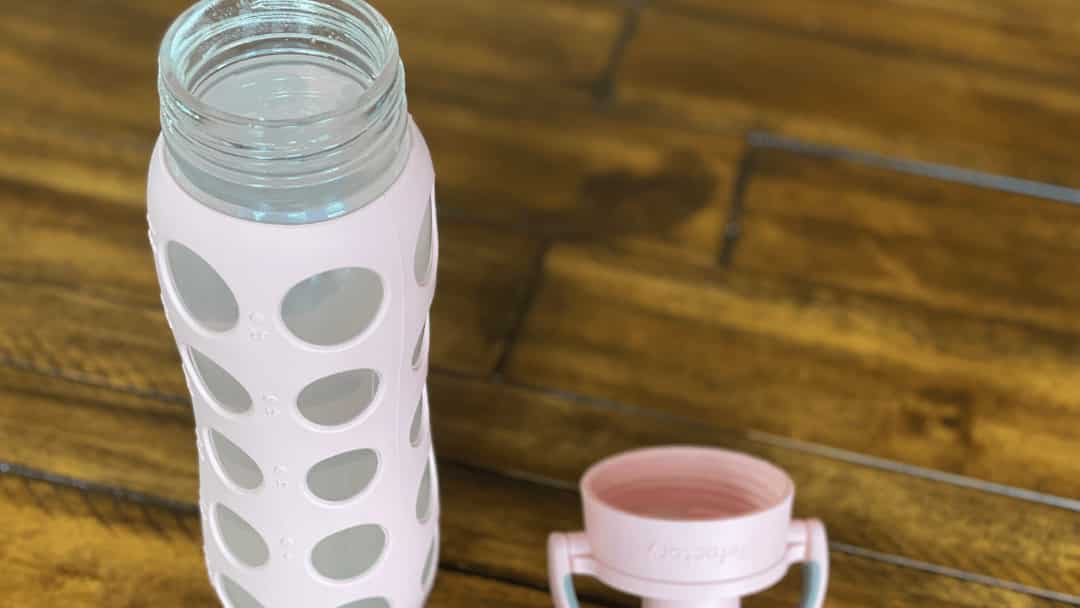 A glass bottle of electrolyte-rich drink, highlighting benefits for POTS and MCAS patients.